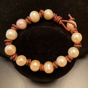 Large freshwater pearl and knotted leather bracelet